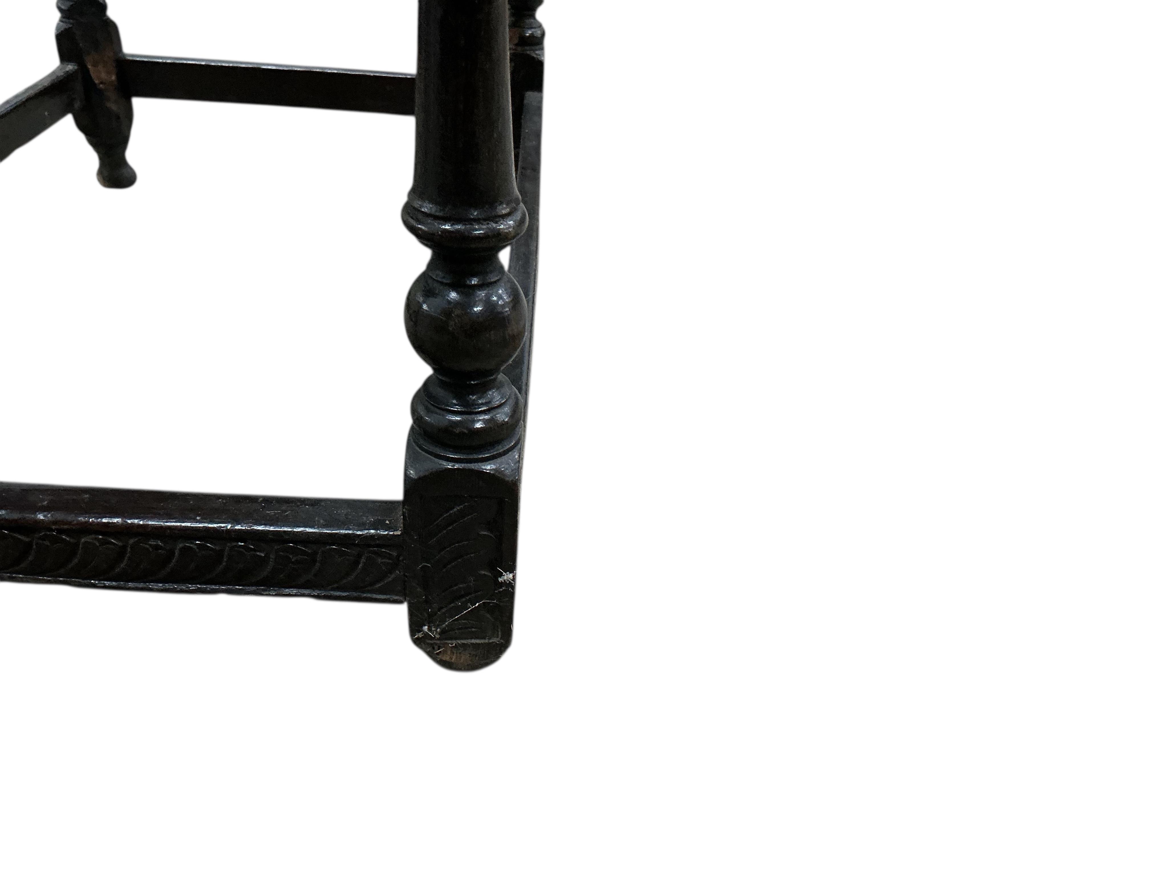 An early 18th century oak side table, later carved, width 99cm, depth 60cm, height 74cm